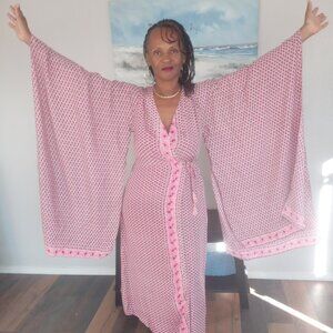 Butterfly Kimono in distinct pink flowers, perfect for vacationing
